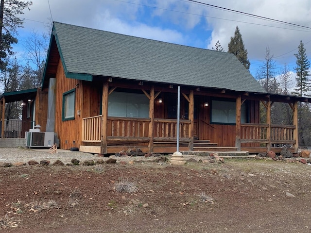 view of front of home with central AC and a porch