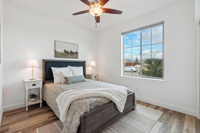 bedroom featuring ceiling fan and wood-type flooring