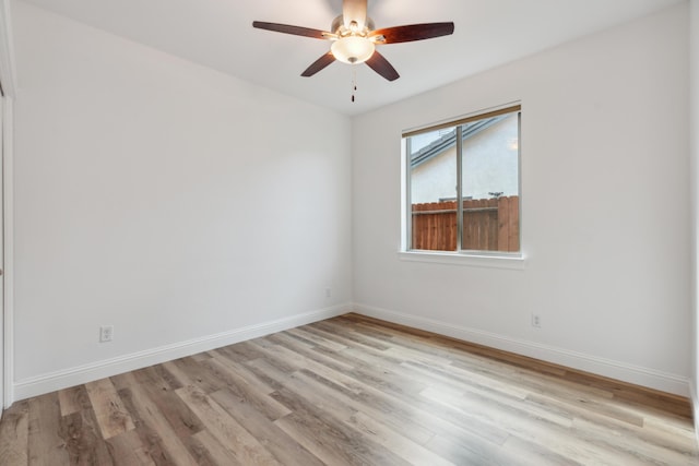 empty room featuring ceiling fan and light hardwood / wood-style floors