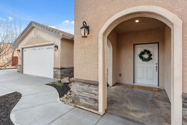 entrance to property featuring a garage