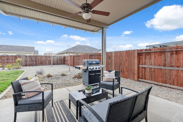 view of patio with an outdoor living space, grilling area, and ceiling fan