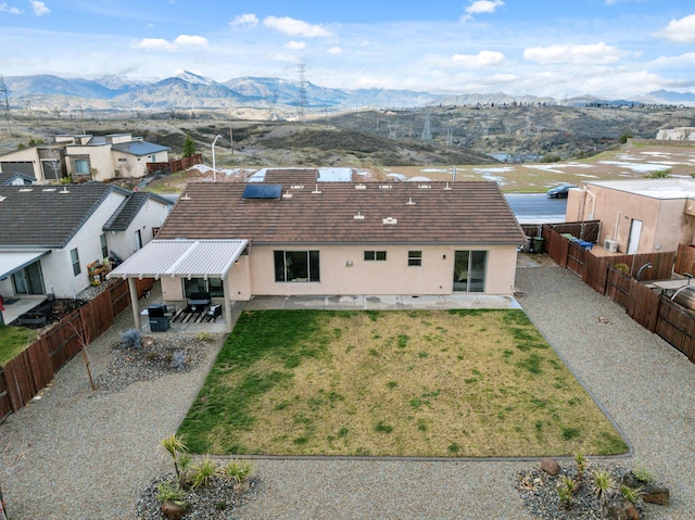 birds eye view of property with a mountain view