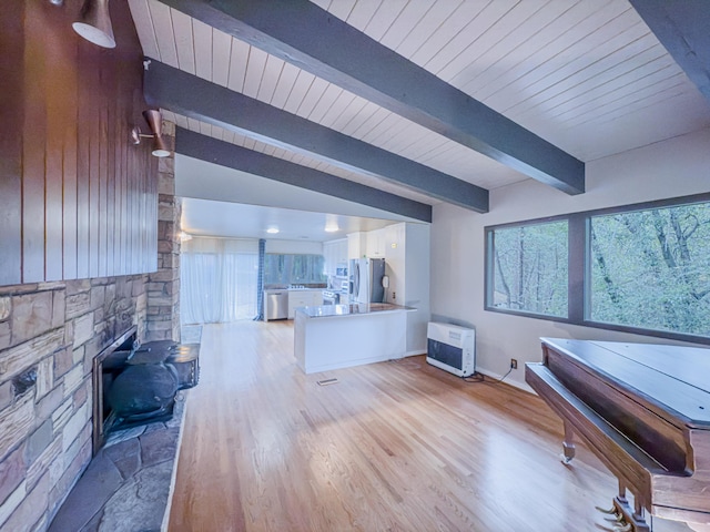 game room with lofted ceiling with beams, heating unit, wood ceiling, and light hardwood / wood-style floors