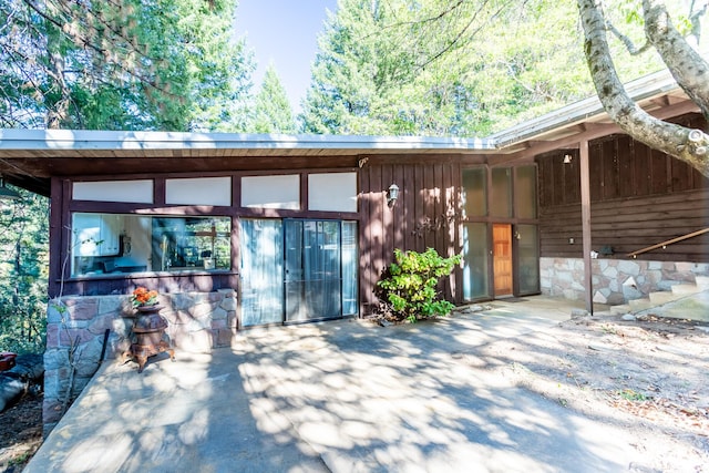 rear view of property featuring a patio