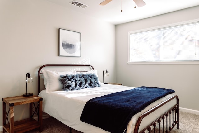 bedroom with ceiling fan, carpet floors, visible vents, and baseboards