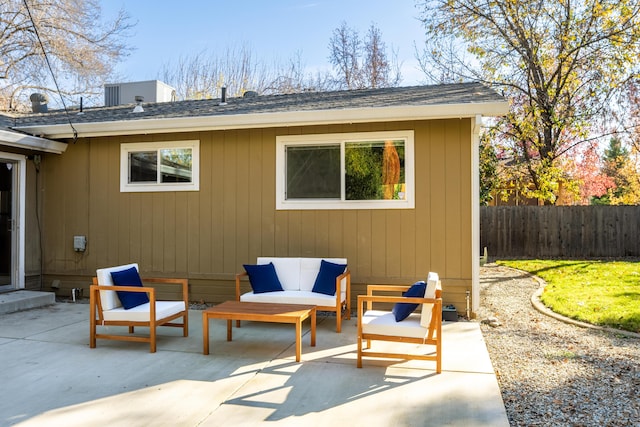 view of patio featuring fence and an outdoor living space