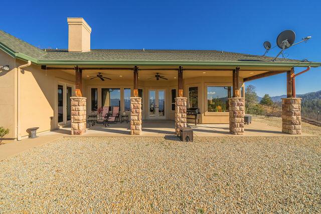 back of house featuring a patio, ceiling fan, and french doors