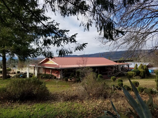 exterior space featuring metal roof