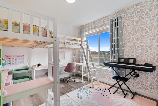 bedroom with wood-type flooring