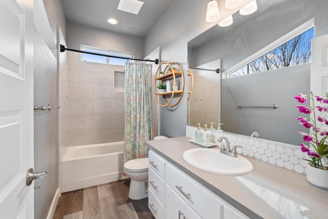 full bathroom featuring vanity, wood-type flooring, toilet, and shower / bath combo