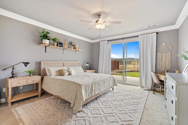 carpeted bedroom featuring ceiling fan and access to outside