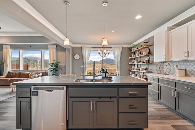 kitchen with sink, white cabinetry, stainless steel dishwasher, gray cabinets, and a mountain view