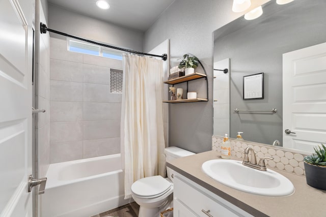 full bathroom with shower / tub combo, vanity, and toilet