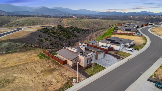 drone / aerial view featuring a mountain view