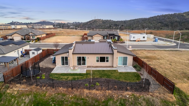 birds eye view of property with a mountain view