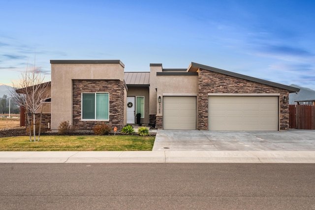 view of front facade with a garage and a front yard