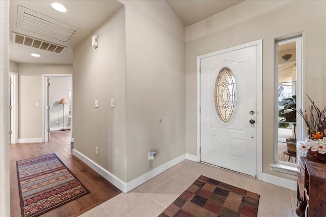 entrance foyer featuring light tile patterned flooring