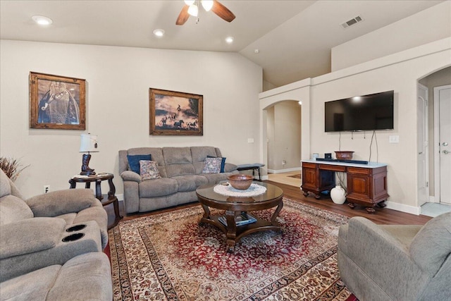 living room with hardwood / wood-style flooring, vaulted ceiling, and ceiling fan