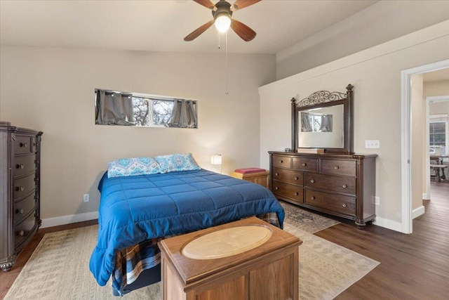 bedroom with wood-type flooring, ceiling fan, and vaulted ceiling