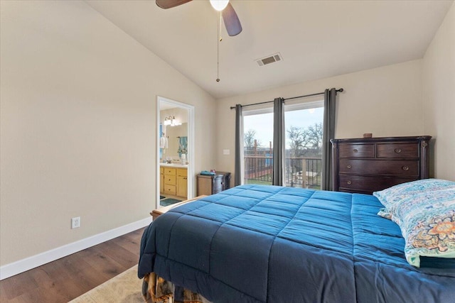 bedroom featuring ceiling fan, dark hardwood / wood-style floors, ensuite bathroom, access to outside, and vaulted ceiling