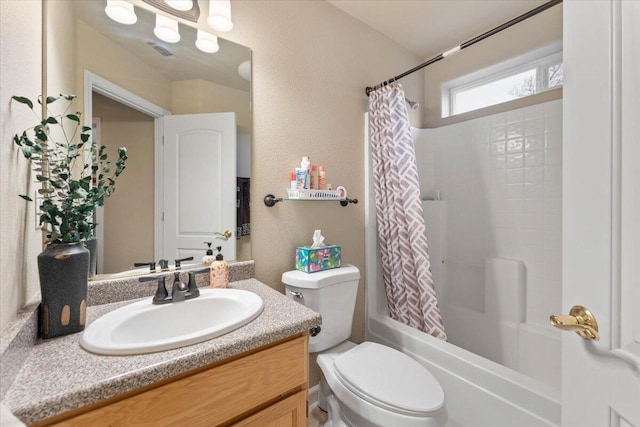 full bathroom with vanity, shower / bathtub combination with curtain, and toilet