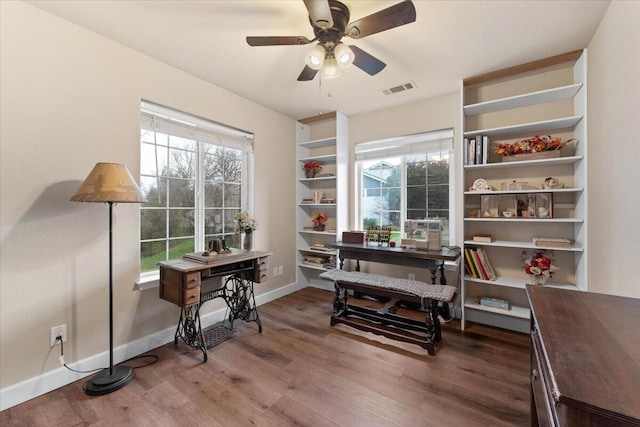 office area featuring wood-type flooring, plenty of natural light, and ceiling fan