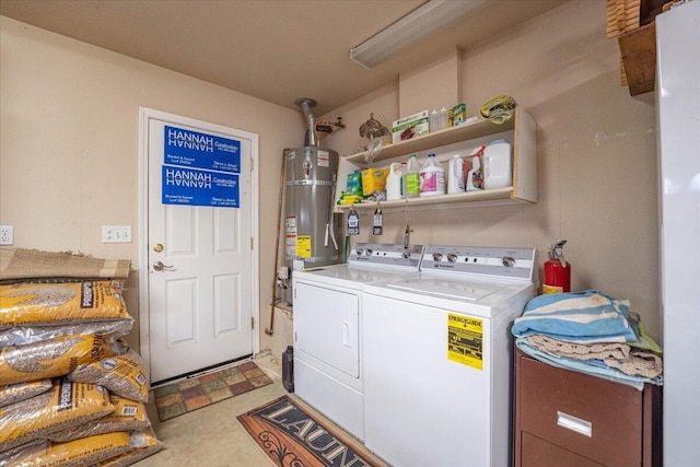 washroom featuring washing machine and clothes dryer and secured water heater