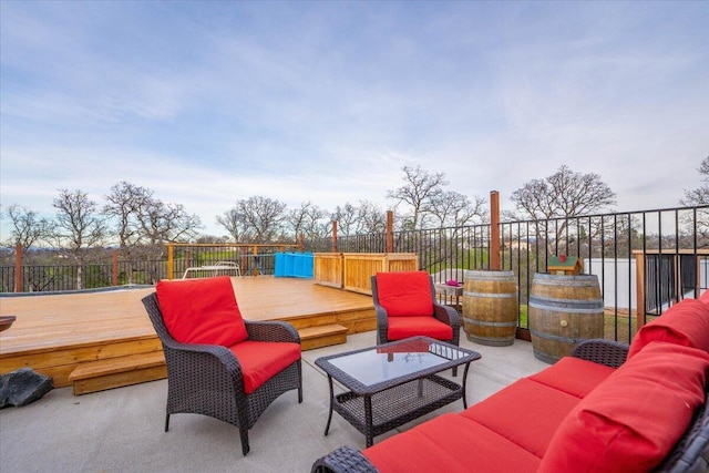 view of patio / terrace with a water view and an outdoor living space