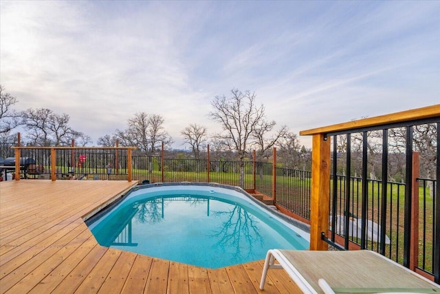 view of pool with a wooden deck