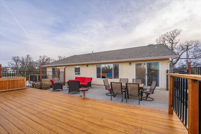 wooden deck featuring an outdoor hangout area