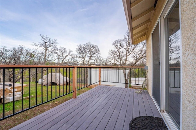 wooden deck with a yard