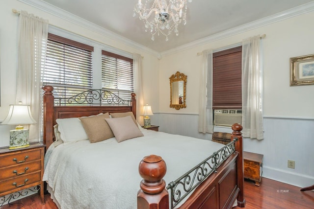 bedroom with an inviting chandelier, cooling unit, crown molding, and dark wood-type flooring