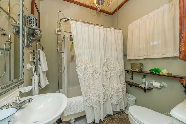 bathroom featuring sink, tile patterned floors, toilet, and walk in shower