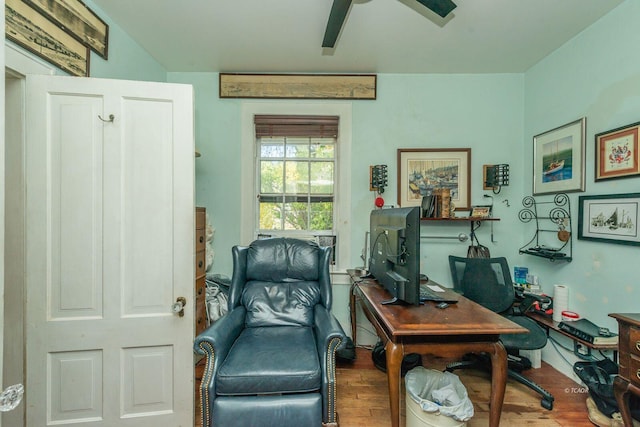 sitting room featuring wood-type flooring and ceiling fan