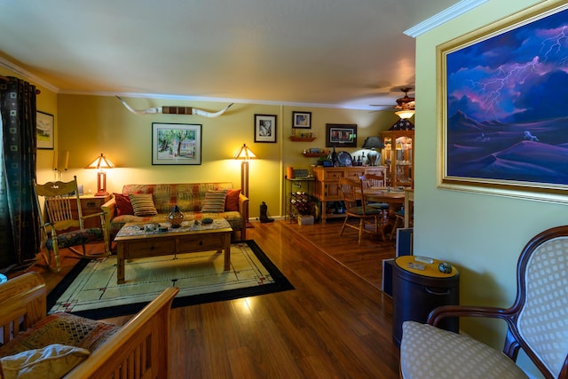 living room with crown molding, hardwood / wood-style floors, and ceiling fan