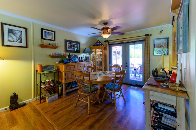 dining space with crown molding, hardwood / wood-style floors, ceiling fan, and french doors