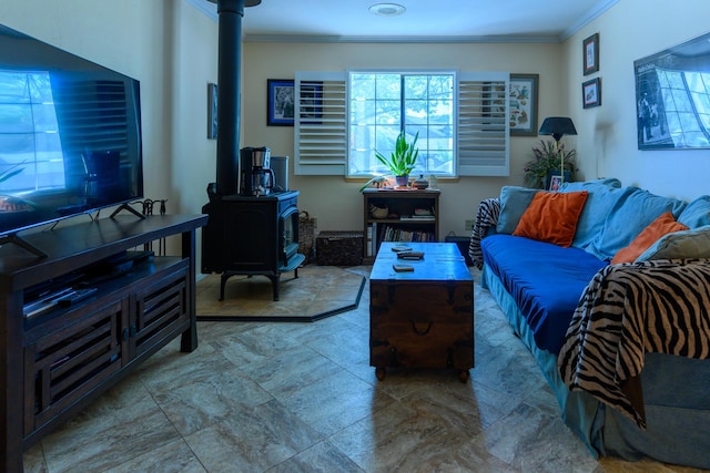 living room with ornamental molding and a wood stove