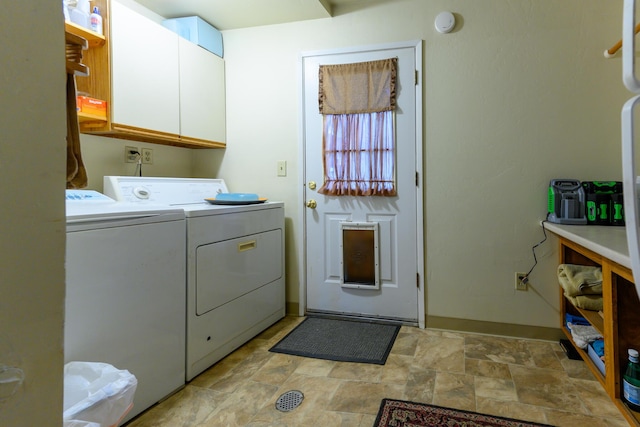 laundry area with cabinets and washer and dryer