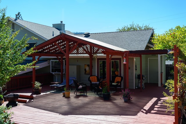 wooden terrace with a grill