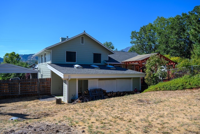 rear view of property with a gazebo