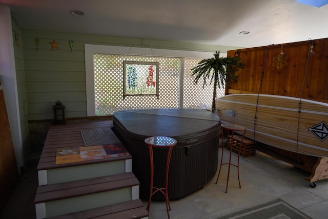 dining space featuring wood walls