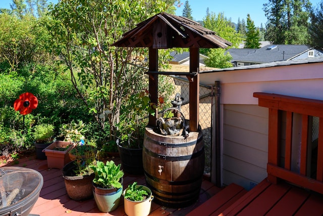 wooden deck with a fire pit