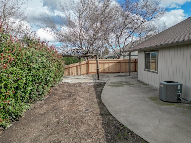 view of yard featuring a gazebo, central AC, and a patio