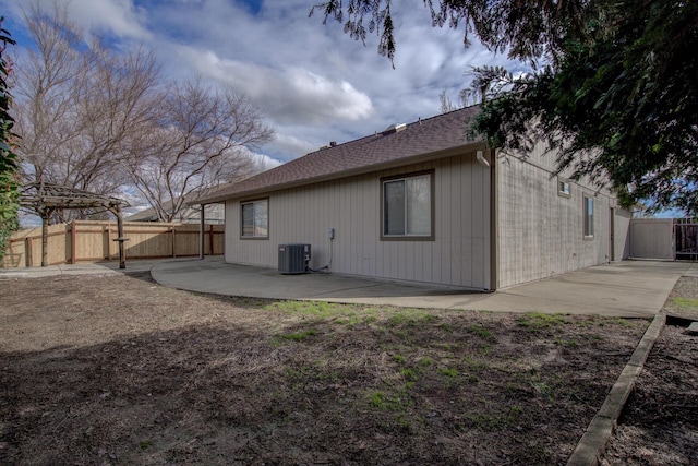 back of house with cooling unit and a patio area