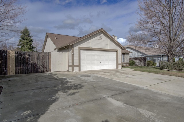 view of side of home with a garage