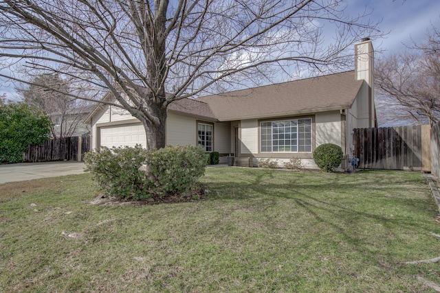 ranch-style house with a garage and a front yard