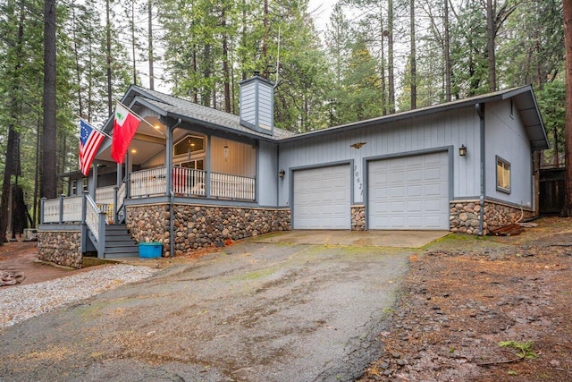 view of front of home featuring a garage and covered porch