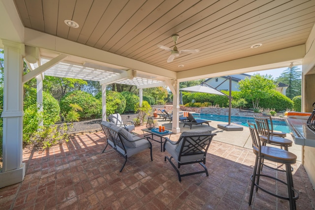 view of patio with pool water feature and ceiling fan