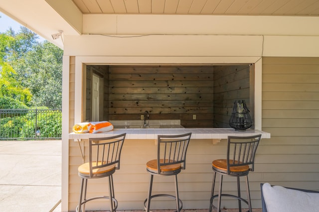 view of patio / terrace featuring an outdoor bar