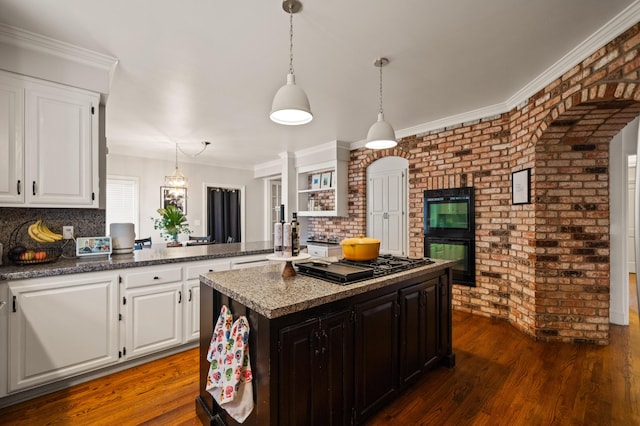 kitchen with white cabinetry, decorative light fixtures, dark wood-type flooring, and black appliances